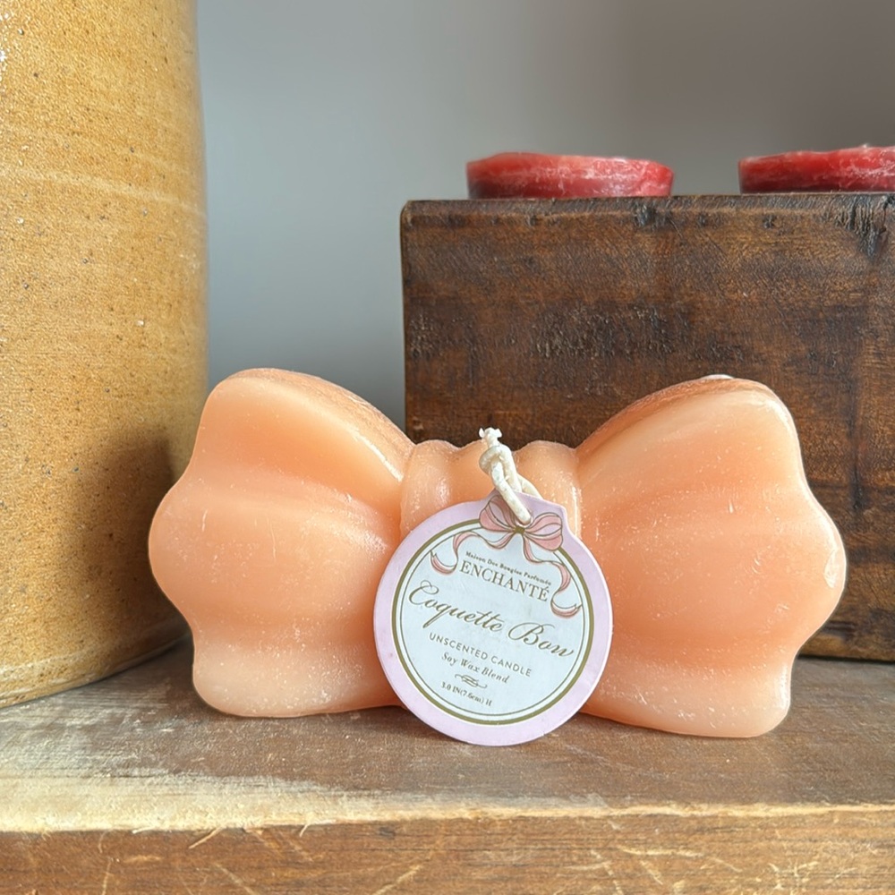 coquette bow unscented candle peach color NWT